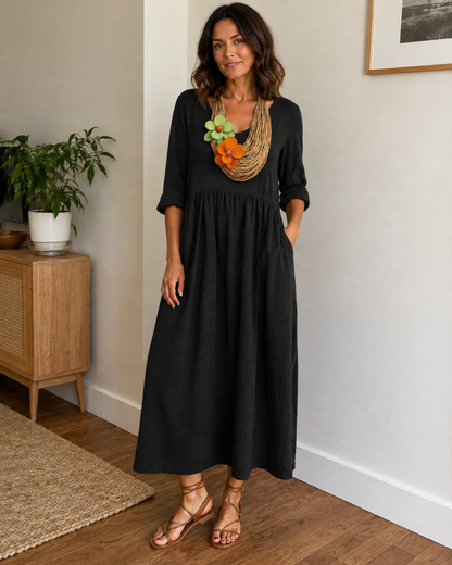 Vestido longo de linho com gola redonda e bolsos